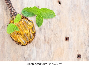 Fish Oil Capsules In A Spoon.