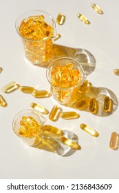 Fish Oil Gelatin Capsules In Laboratory Transparent Flasks .Healthy Eating And Food Supplements.omega Fatty Acids. Flying Capsules Fish Oil..Natural Supplements And Vitamin