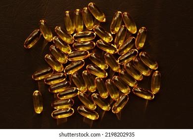 Fish Oil Pills. Omega 3 Gel Capsules On Black Background