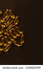 Fish Oil Pills. Omega 3 Gel Capsules On Black Background