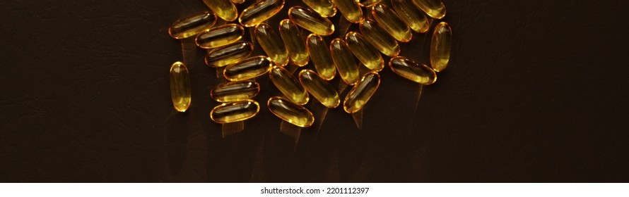 Fish Oil Pills. Omega 3 Gel Capsules On Black Background