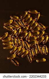 Fish Oil Pills. Omega 3 Gel Capsules On Black Background