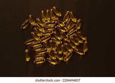 Fish Oil Pills. Omega 3 Gel Capsules On Black Background