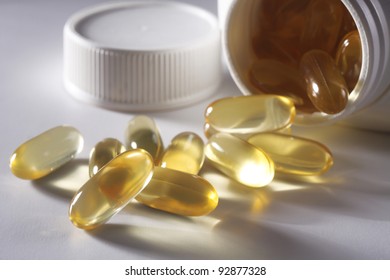 Fish Oil Tablet Pouring Out From Bottle