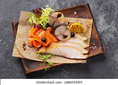 Fish plate with different types of smoked and salted fish