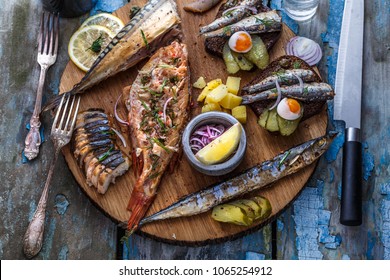 Fish plate with sturgeon, trout, perch, mackerel. Assorted fish on a plate