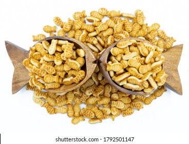 Fish Shaped Bowl Full Of Goldfish Crackers Sitting On Cracker Pile