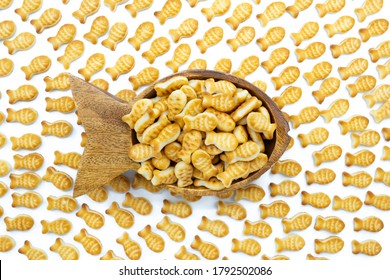 Fish Shaped Bowl Full Of Goldfish Crackers.