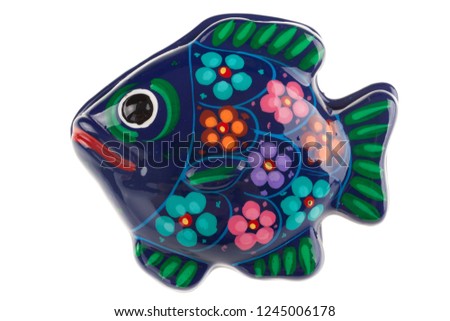 a fish shaped ceramic box isolated over a white background