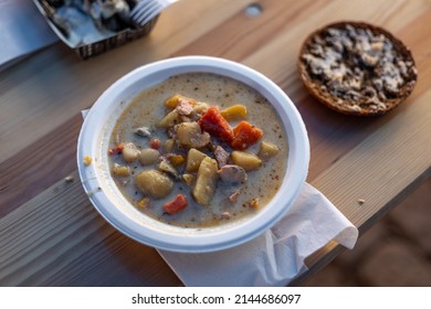 Fish Soup In A Cardboard Bowl With A Piece Of Rye Bread Served In Herring Market In Turku, Finland.