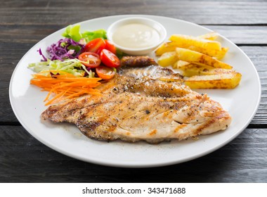 fish steak on wood table