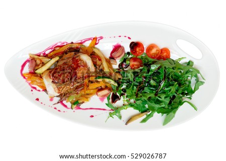Fish steak with vegetable ratatoille and rocket salad, isolated on white
