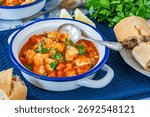 Fish stew made of cod, salmon, smoked haddock and prawns