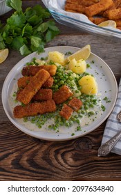 Fish Sticks With Vegetable, Potatoes And Bechamel Sauce On A Plate