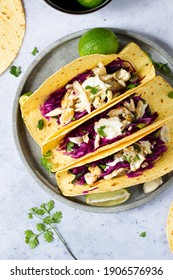 Fish Tacos With Red Cabbage Salsa And Fresh Lime On Side, Top View Of A Traditional Mexican Street Food, Homemade With Marinated Fish In Lime And Mexican Crema 