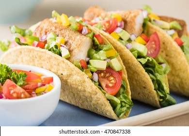 Fish Tacos Shell With Tomato, Beans, Capsicum And Avocado Salsa