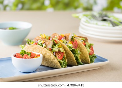 Fish tacos shell with tomato, beans, capsicum and avocado salsa