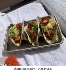 Fish Tacos In Tray On White Beach Towel