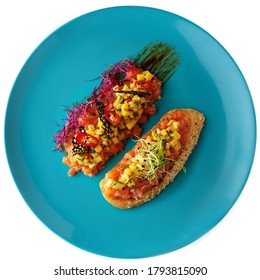 Fish Tartare With Mango Salsa On Wooden Table, Isolated On White Background.