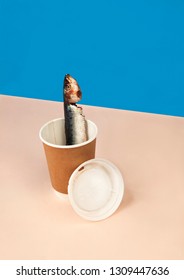 A Fish In A Throw Away Coffee Cup. This Is A Conservational Campaign Piece To Encourage People To Stop Buying Throw Away Coffee Cups As They Harm Sea Life.