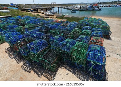 Fish traps-octopus pots on the cement dock waiting to be baited with -usually- mackerel and a lure of aluminum foil, then to be used by the fishing boats of Alvor village. Portimao-Algarve-Portugal.