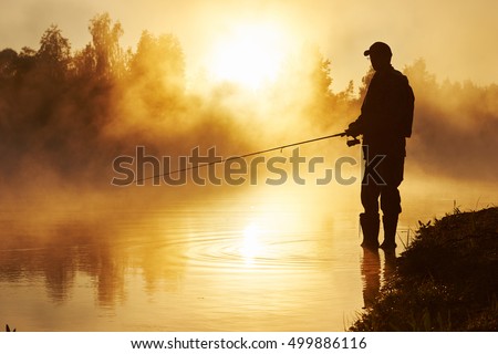 fisher fishing on foggy sunrise