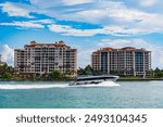 Fisher Island travel destination. Yacht in Miami beach. Luxury lifestyle. Summer vacation. A luxury motor yacht. Miami yachting. Yacht vacation in summer. Luxury yacht in Miami. Private luxury boat