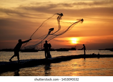 Fisher Man Net With Sunset In The Sea