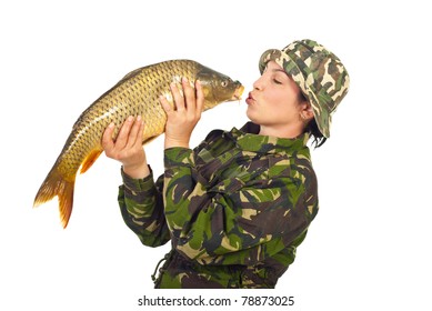 Fisher woman kissing big carp fish isolated on white background
