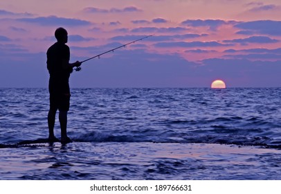 fisherman in action on sunset time - Powered by Shutterstock