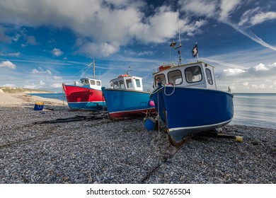 Fisherman boats on pebbles at beach in Beer, Devon,UK. Jurassic coast british heritage.