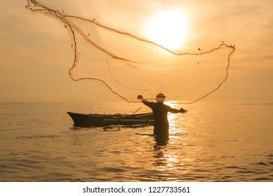 Fisherman Casting Net During Sunrise Fishing Stock Photo Edit Now 1227733561