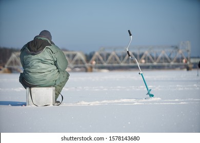 Fisherman enjoying a days fishing on the ice - Powered by Shutterstock