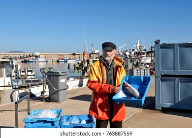 Fisherman With A Fish Box 