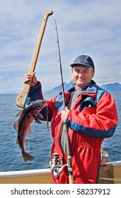 Fisherman With A Fish On The Lofoten Island