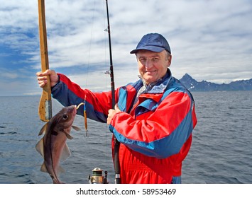 Fisherman With A Fish On The Lofoten Island