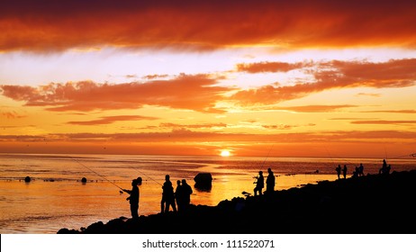 Fisherman fishing on the Atlantic Ocean, Holland - Powered by Shutterstock