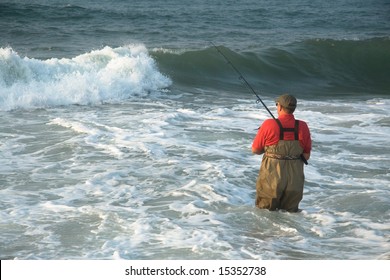 Fisherman fishing in surf on Beach