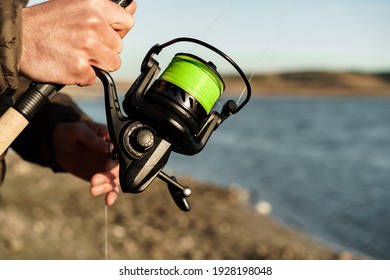 Fisherman Hands Holding Fishing Rod Close Up