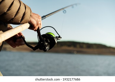 Fisherman Hands Holding Fishing Rod Close Up