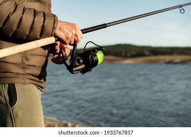 Fisherman Hands Holding Fishing Rod Close Up