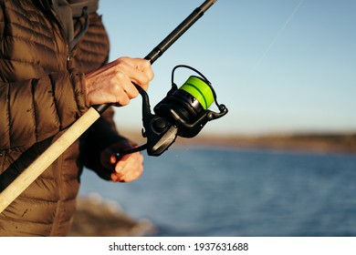 Fisherman Hands Holding Fishing Rod Close Up