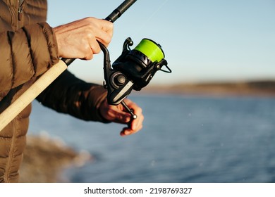 Fisherman Hands Holding Fishing Rod Close Up