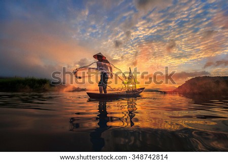 Fisherman of Mekong River in action when fishing, Thailand