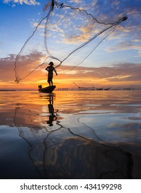 Fisherman With Net In Action ,Thailand