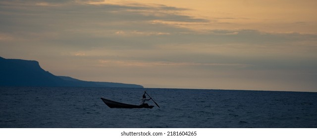 Fisherman On Boat Before The Storm