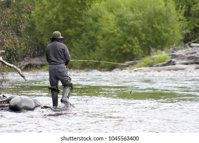 Fisherman On The River. Kamchatka. Russia.