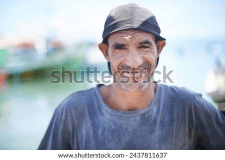 Fisherman, portrait and rugged man with smile, harbour and wrinkles from sunlight exposure. Boats, ships and water or fishing for work in Brazil, closeup and senior male angler for career by ocean