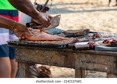 Fisherman Preparing Fish To Sell On The Colombian Beach