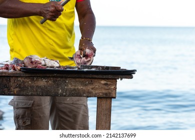 Fisherman Preparing Fish To Sell On The Colombian Beach